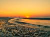 Tide Flowing At Sunrise